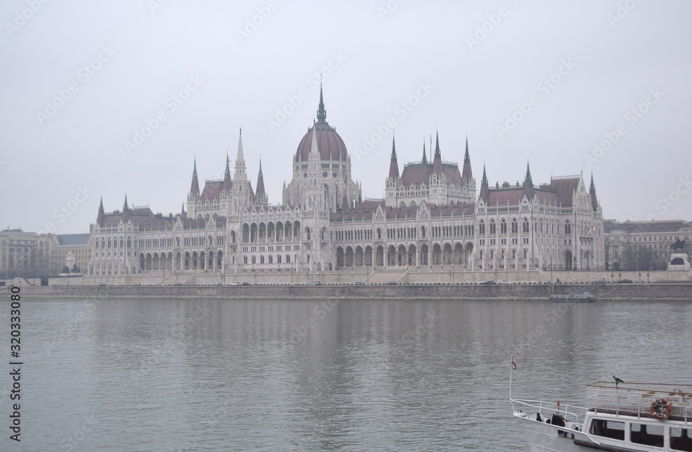 Ship on Danube river, Parliament in the fog background
