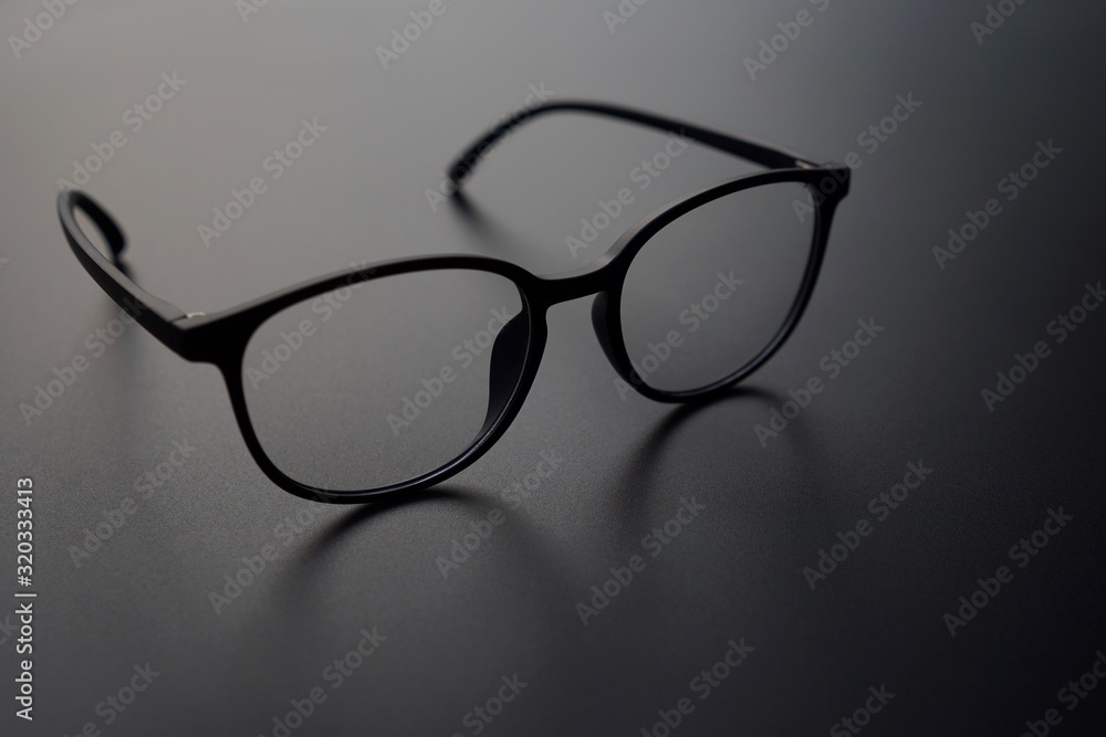 A beautiful eyeglasses on the black background A beautiful eyeglasses on the black background
