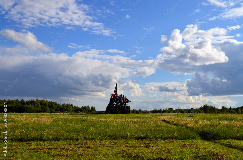 Beautiful summer landscape. Yellow-green field and blue sky with clouds. Beautiful summer landscape. Yellow-green field and blue sky with clouds.