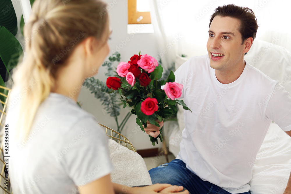 Young couple lover give rose flower in valentine's day. Young couple lover give rose flower in valentine's day.