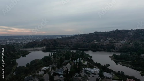 Aerial over Hollywood Resevoir with downtown Hollywood in the background. 4K