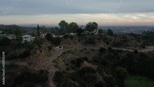 Flyover Lake Hollywood to reveal downtown Los Angeles at twilight hour. 4K