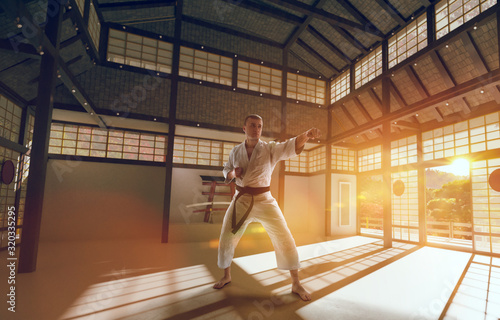 Karate fighters on tatami at sunrise. Japanese hall.