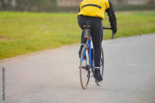 mature man cycling in autumn © Image'in