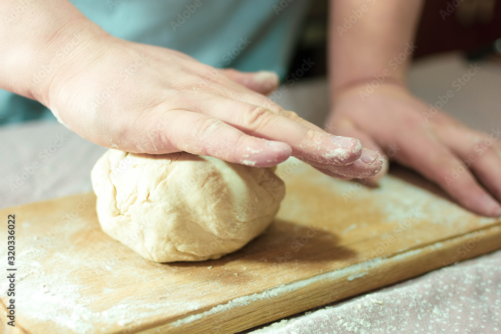 Knead the dough on a wooden board