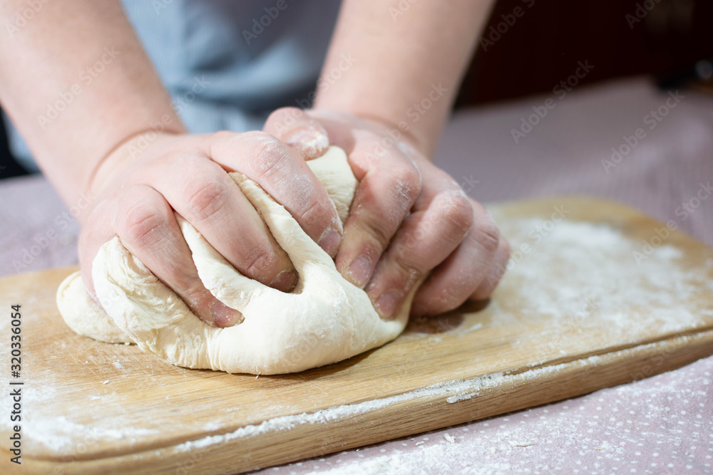 Knead the dough on a wooden board