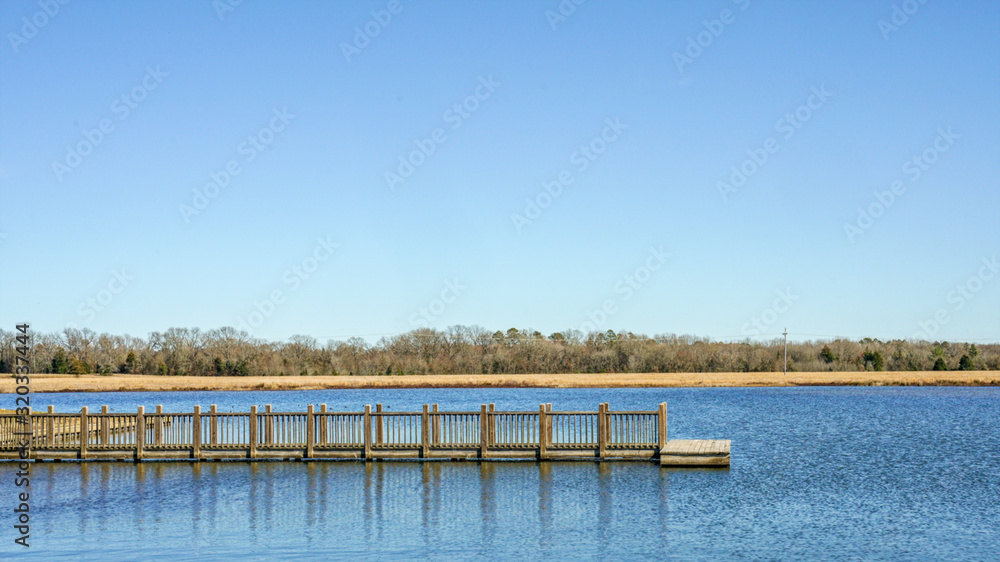 Boat dock on a lake on a clear day.