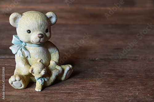 teddy bears on a wooden background