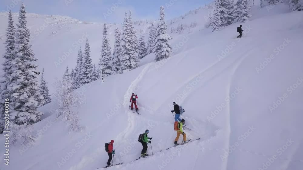 Ski touring walk up drone shot in the mountains Ski touring walk up drone shot in the mountains
