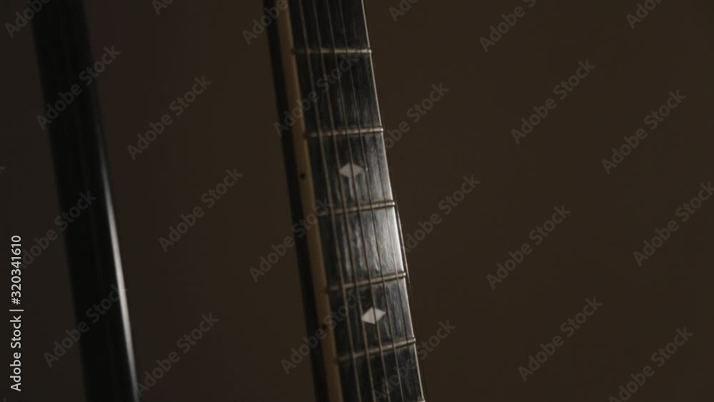 Tilt Up Of Acoustic Guitar From Neck To The Head With Cappo - Close Up Shot Tilt Up Of Acoustic Guitar From Neck To The Head With Cappo - Close Up Shot