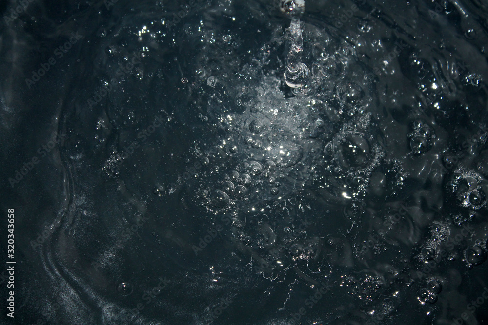 Black water drops of water