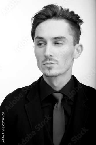 Handsome young elegant man studio portrait.