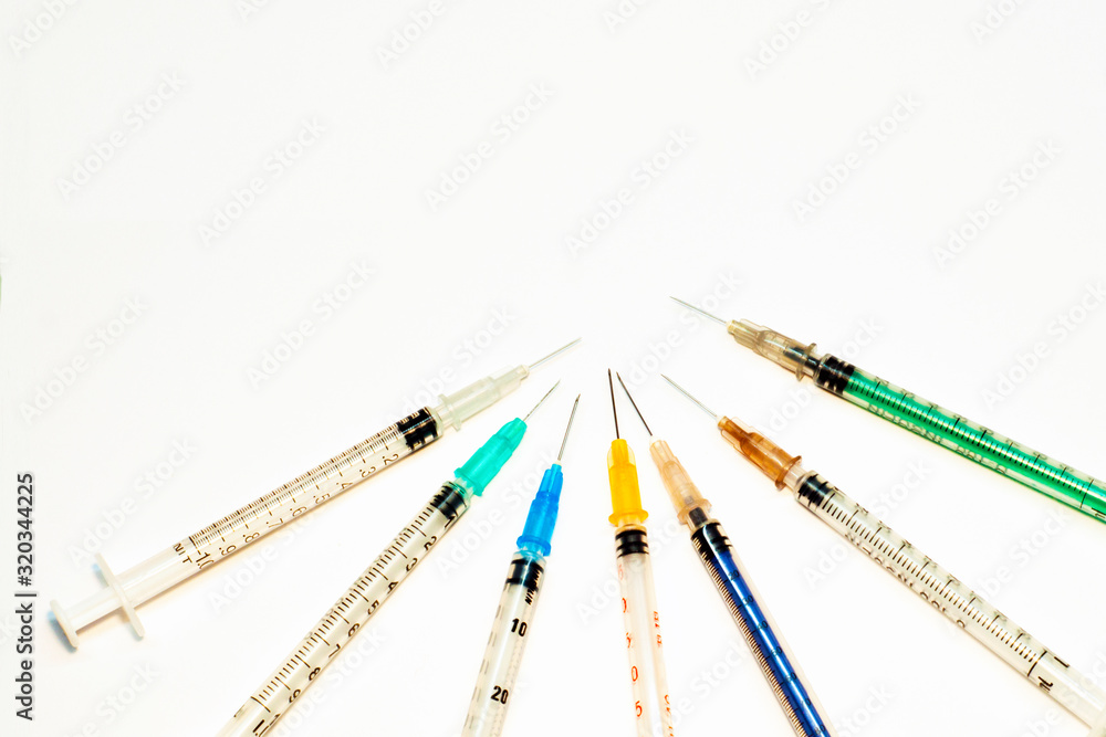 Medical syringes. Injection syringes and vaccines. Syringe with a needle. The concept of health, disease, drug. Medical syringes. Injection syringes and vaccines. Syringe with a needle. The concept of health, disease, drug.