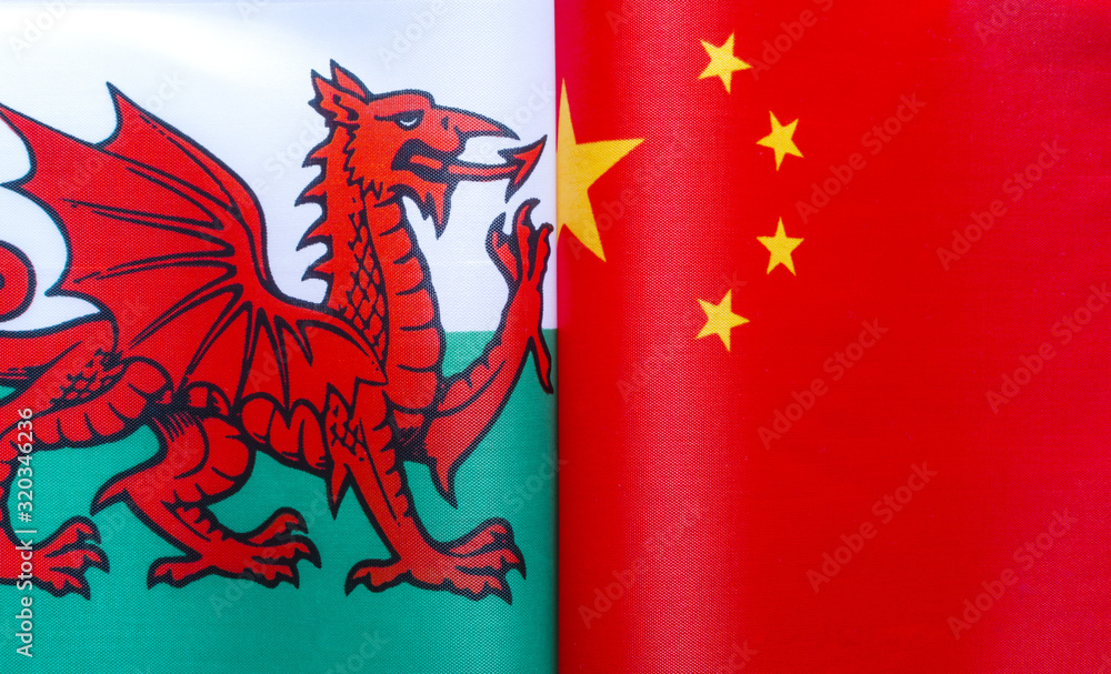 fragments of national flags of Wales and China close-up fragments of national flags of Wales and China close-up