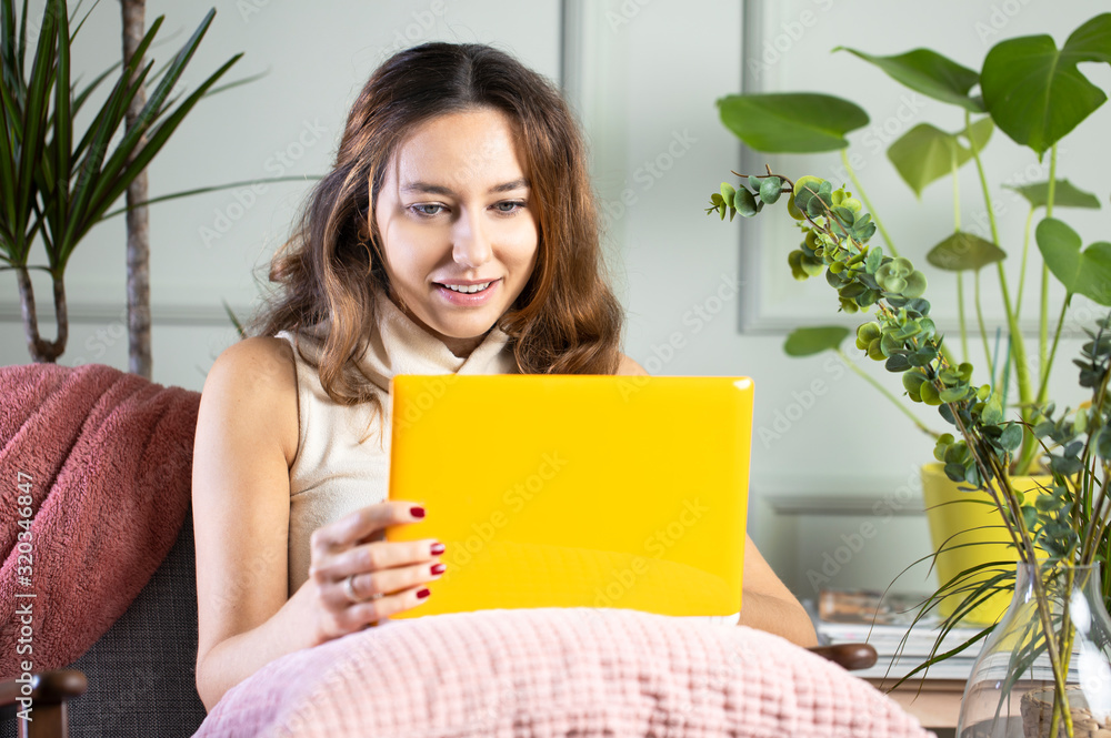 Young woman working at home.