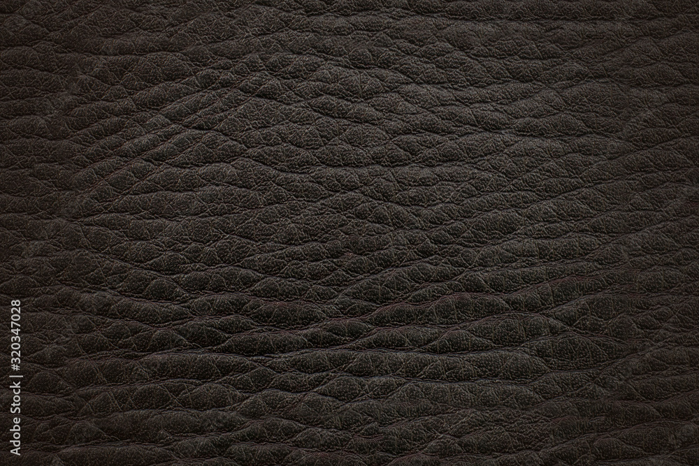Fototapeta premium Dark black-brown leather. Textural surface.