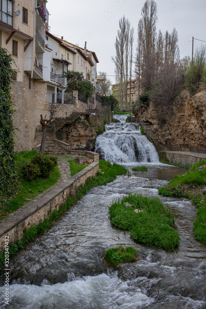 Cifuentes river waterfall when it passes through the center of Trillo, Guadalajara, Spain