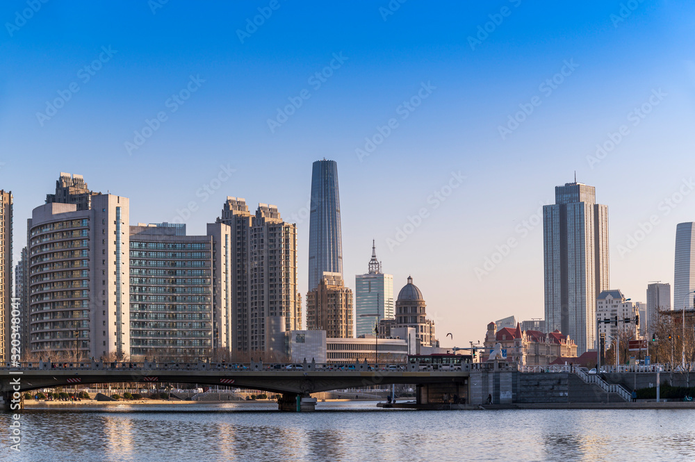 Beautiful waterfront cityscape with historical buildings and modern skyscaper building on riverside (Haihe River) tianjin city,  China