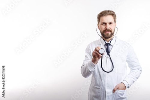 Принти на полотні Smiling bearded MD posing with stethoscope ready to auscultate isolated white ba