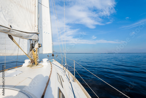 Obraz na plátně White sloop rigged yacht sailing near the coast of Maine, Southwest Harbor, USA