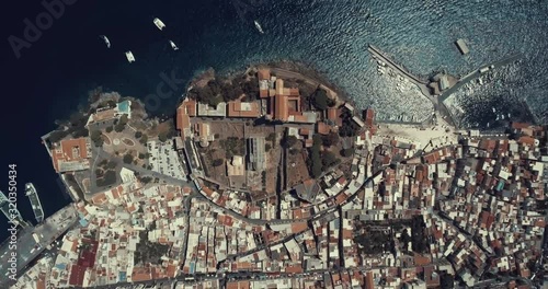 Drone zenithal aerial view of the the old town of Lipari, Aeolian islands, Sicily, Italy. Stunning panorama with Mediterranean blue sea and harbor on the top photo