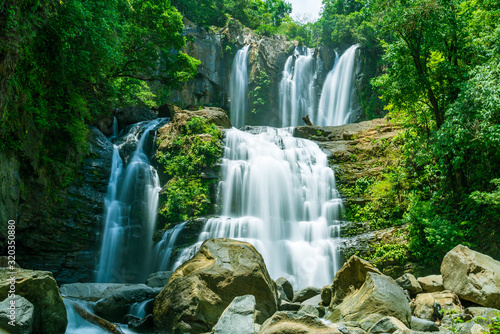 The tapering Nauyaca Waterfalls in Costa rica  a majestic cascading fall in Dominical province  Costa Rica