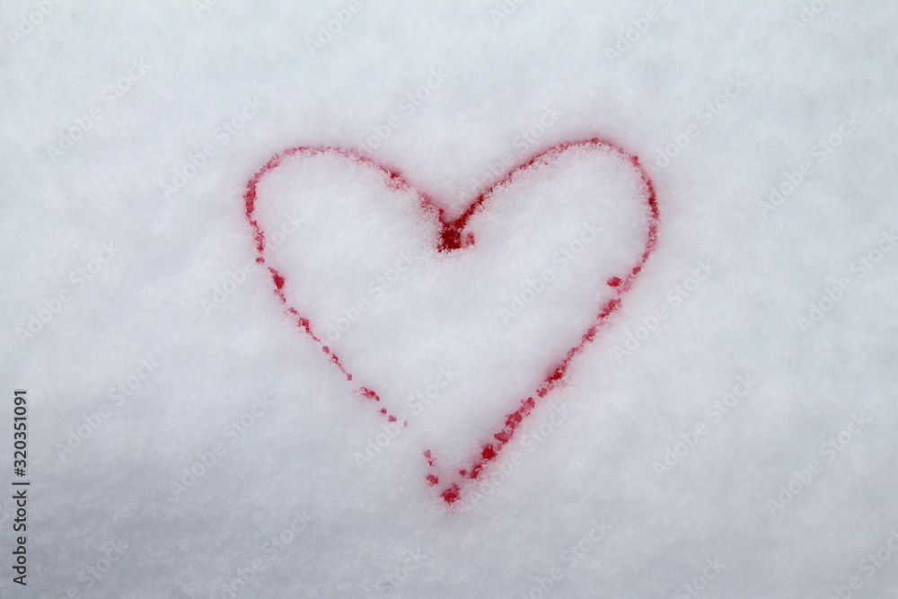 Red heart painted with red paint on snow symbol of love postcard for Valentines Day