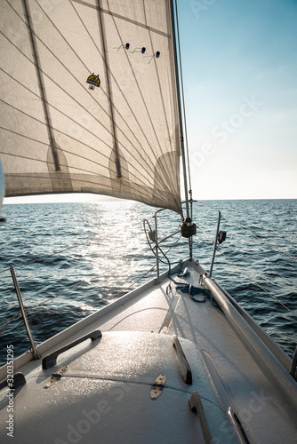 yacht sailing in sun lights