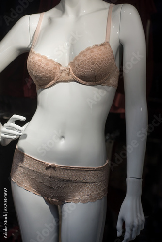 closeup of beige underwear on mannequin in fashion store showroom for women