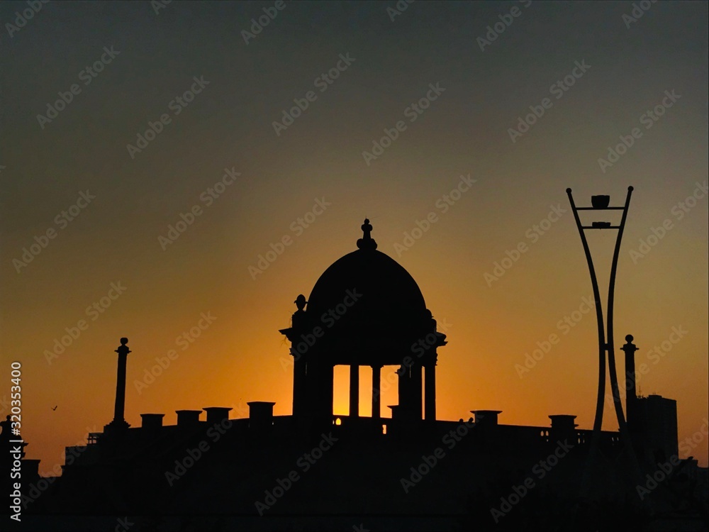 The silhouette of Jehangir Kothari Parade during sunset