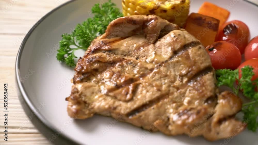 grilled and barbecue fillet pork steak with corn, carrot and tomatoes grilled and barbecue fillet pork steak with corn, carrot and tomatoes