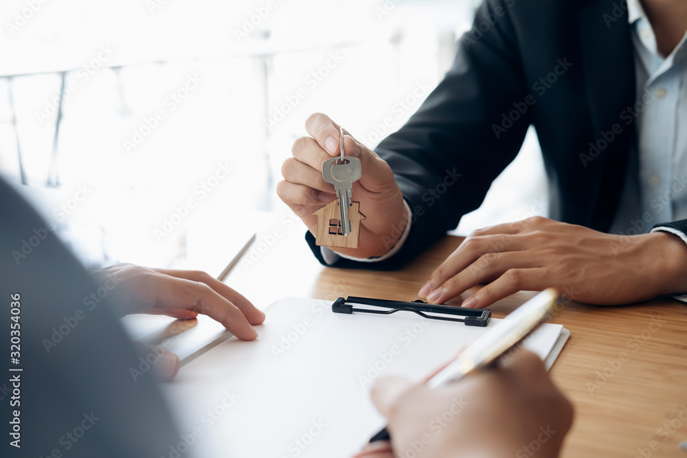 Customer signing contract for a new house. Customer signing contract for a new house.