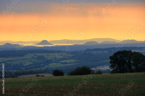 Fototapeta Naklejka Na Ścianę i Meble -  Sunrise over the Saxon Switzerland, rocks Lilienstein, fortress Koenigstein