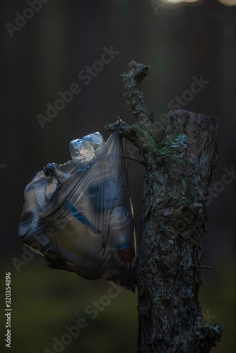 forest with plastic bag trash 