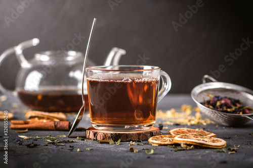 A Cup of freshly brewed black tea on dark background