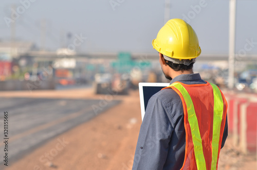 Road construction engineer on site