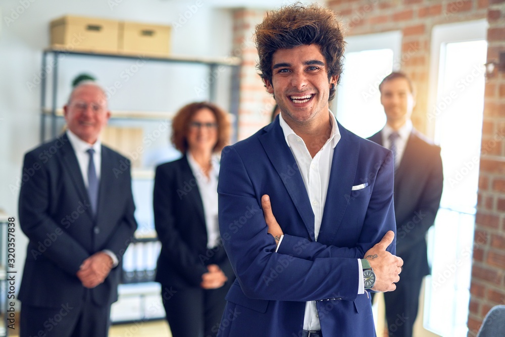 Group of business workers smiling happy and confident in a meeting. Standing with smile on face looking at camera at the office. Group of business workers smiling happy and confident in a meeting. Standing with smile on face looking at camera at the office.