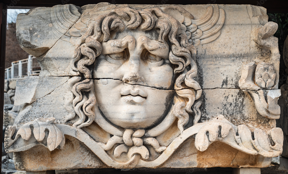 The statue of the mythological entity medusa, known for its snake hair. The head statue, which became the symbol of the temple of Apollo and Didyma. 
