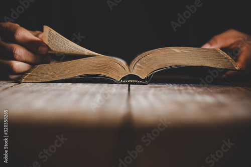 a christian man reading the bible. photo