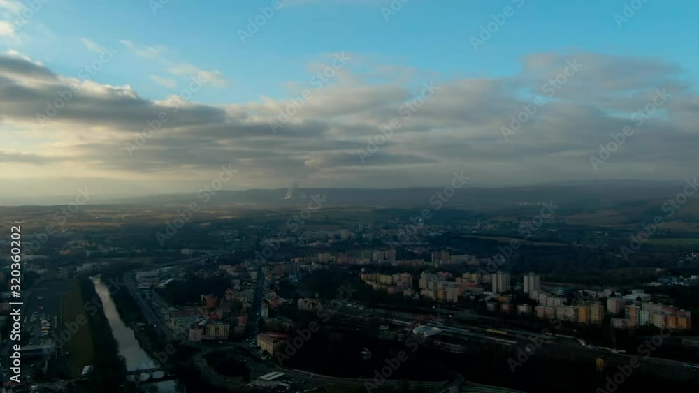 aerial view of Pine trees forest on cold winter morning with early warm sunlight european city aerial view of Pine trees forest on cold winter morning with early warm sunlight european city