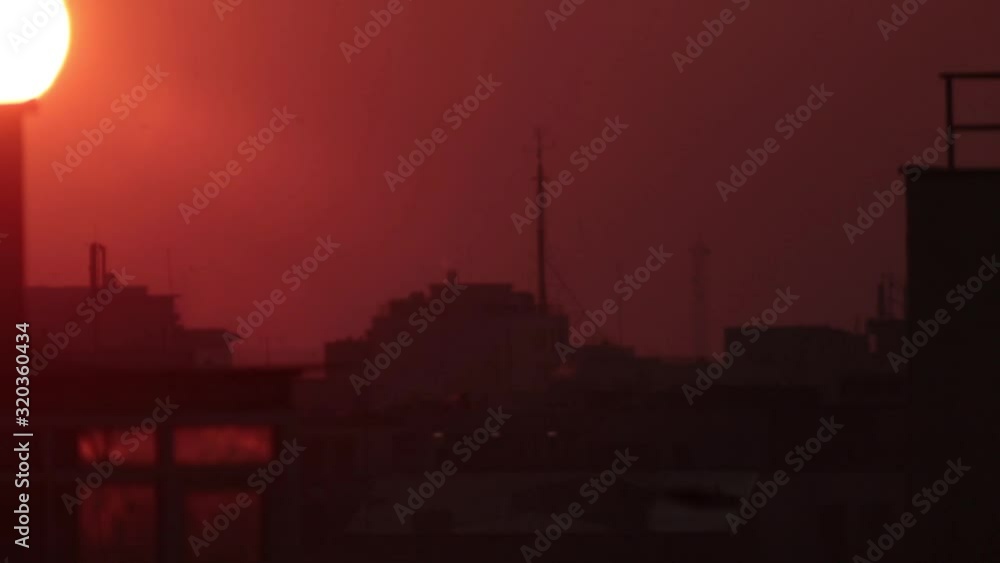 urban sunset with window reflection urban sunset with window reflection