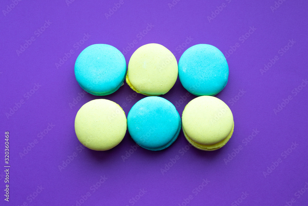 macaroni cookies in the center on a purple bright background macaroni cookies in the center on a purple bright background