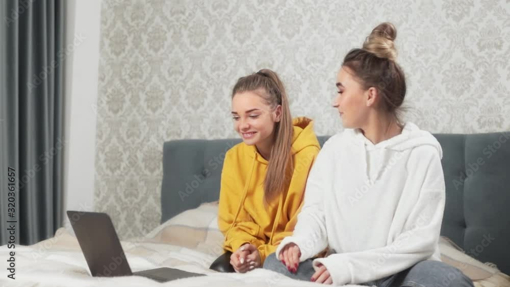 girls communicate on laptop computer webcam, girls hug girls communicate on laptop computer webcam, girls hug