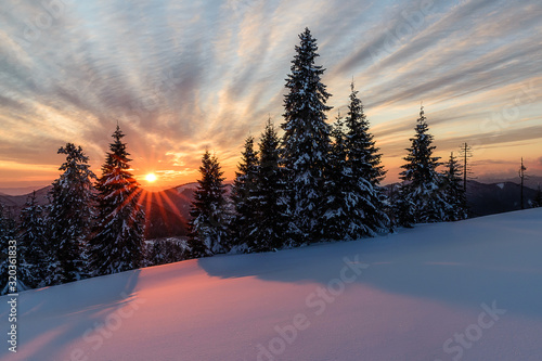 Wonderful sunset with snow and beautiful clouds