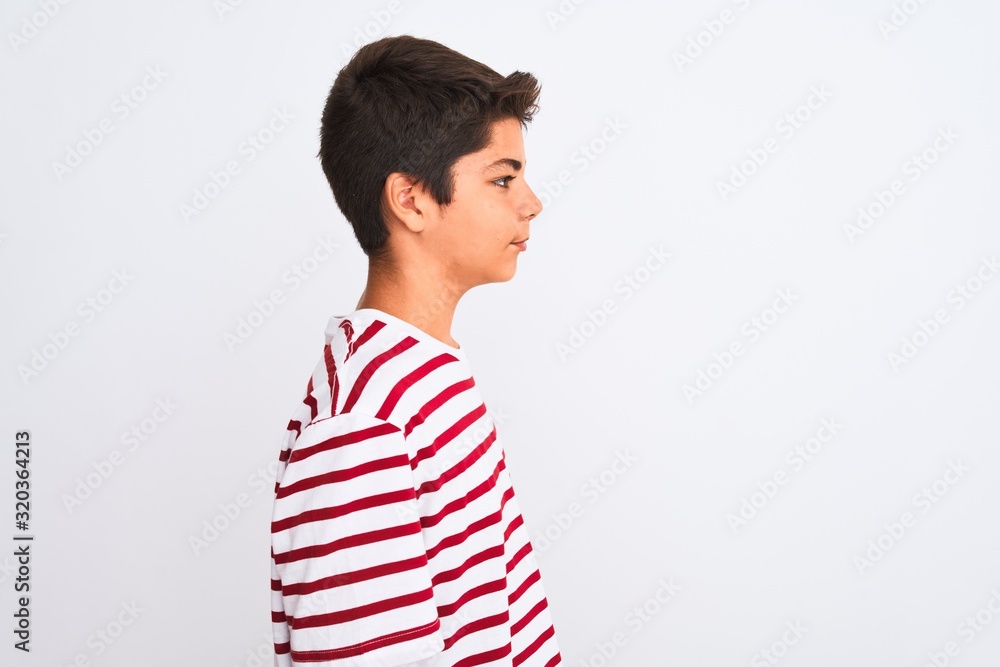 Handsome teenager boy standing over white isolated background looking to side, relax profile pose with natural face with confident smile. Handsome teenager boy standing over white isolated background looking to side, relax profile pose with natural face with confident smile.
