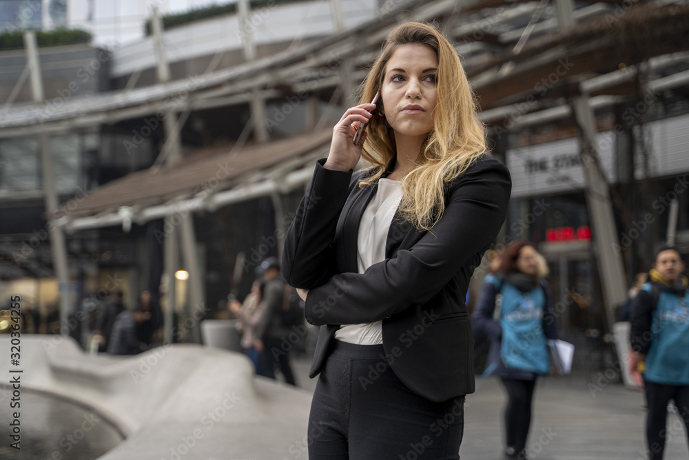 Blonde Businesswoman Talking On The Phone