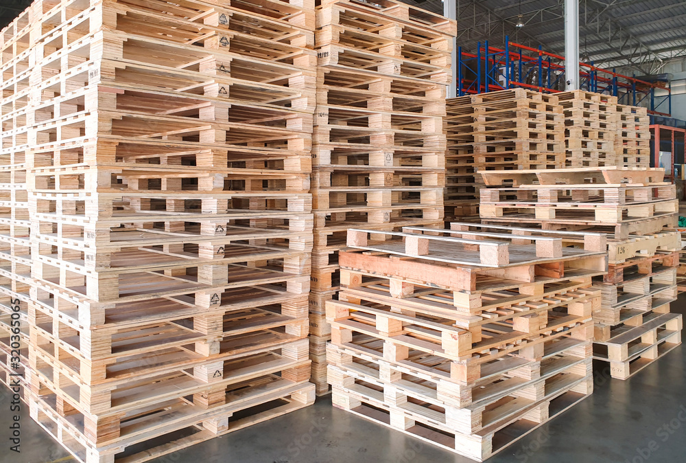 Stack of wooden pallets in interior warehouse. Stack of wooden pallets in interior warehouse.
