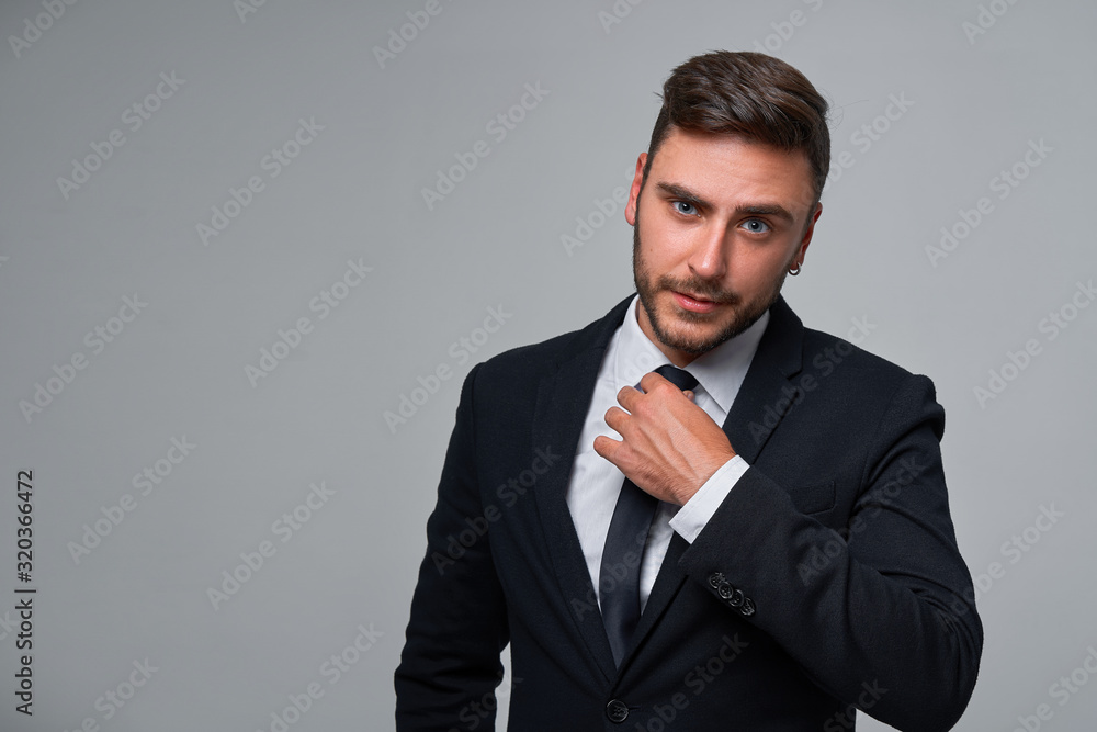Close up portrait young man businessman. Caucasian guy business suit studio gray background. Close up portrait young man businessman. Caucasian guy business suit studio gray background.