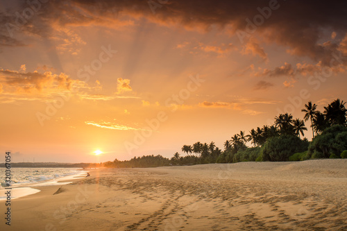 Sunset on the sandy tropical beach, Sri Lanka, beautiful nature, wide 