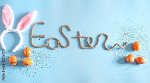 Easter creative inscription on a blue background.